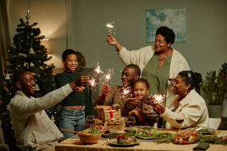 Happy African American Family Celebrating Christmas at Home